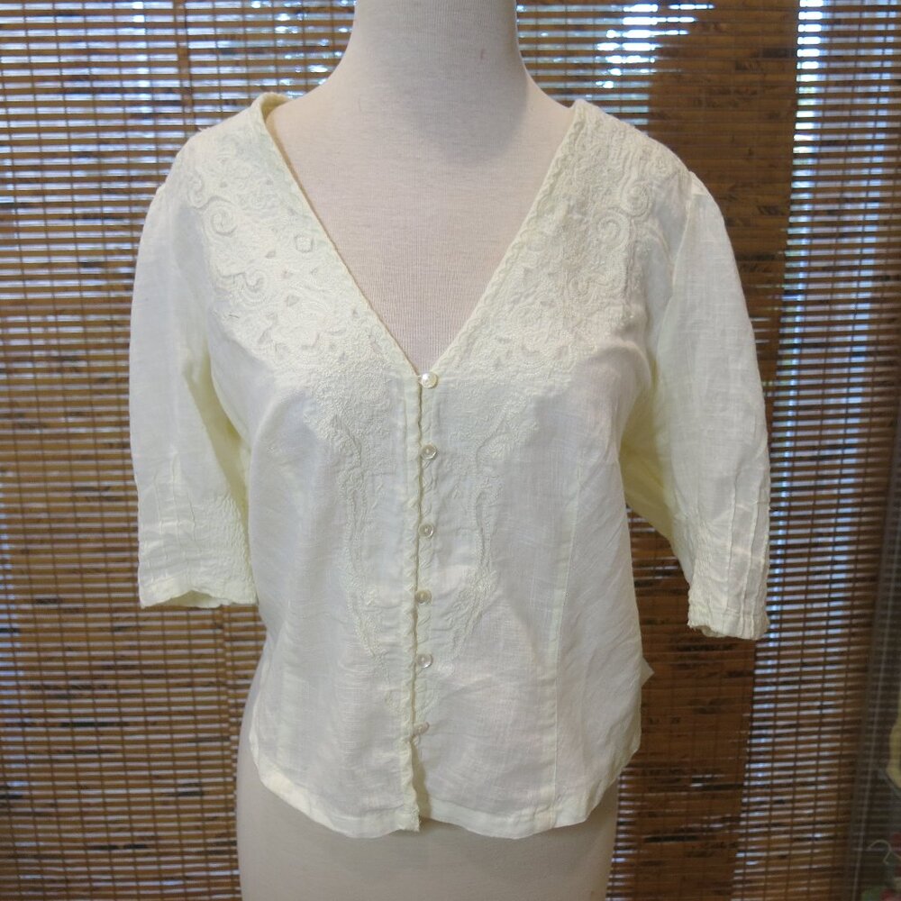Free people cream top embroidered, tapered back. Size small petite.